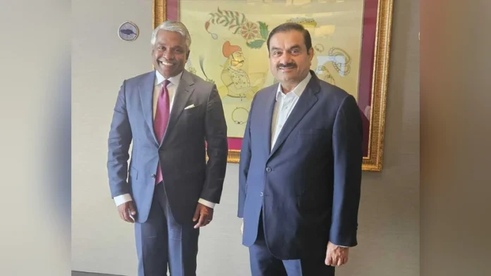 CEO of Google Cloud Thomas Kurian (L) and Chairman of Adani Group Gautam Adani